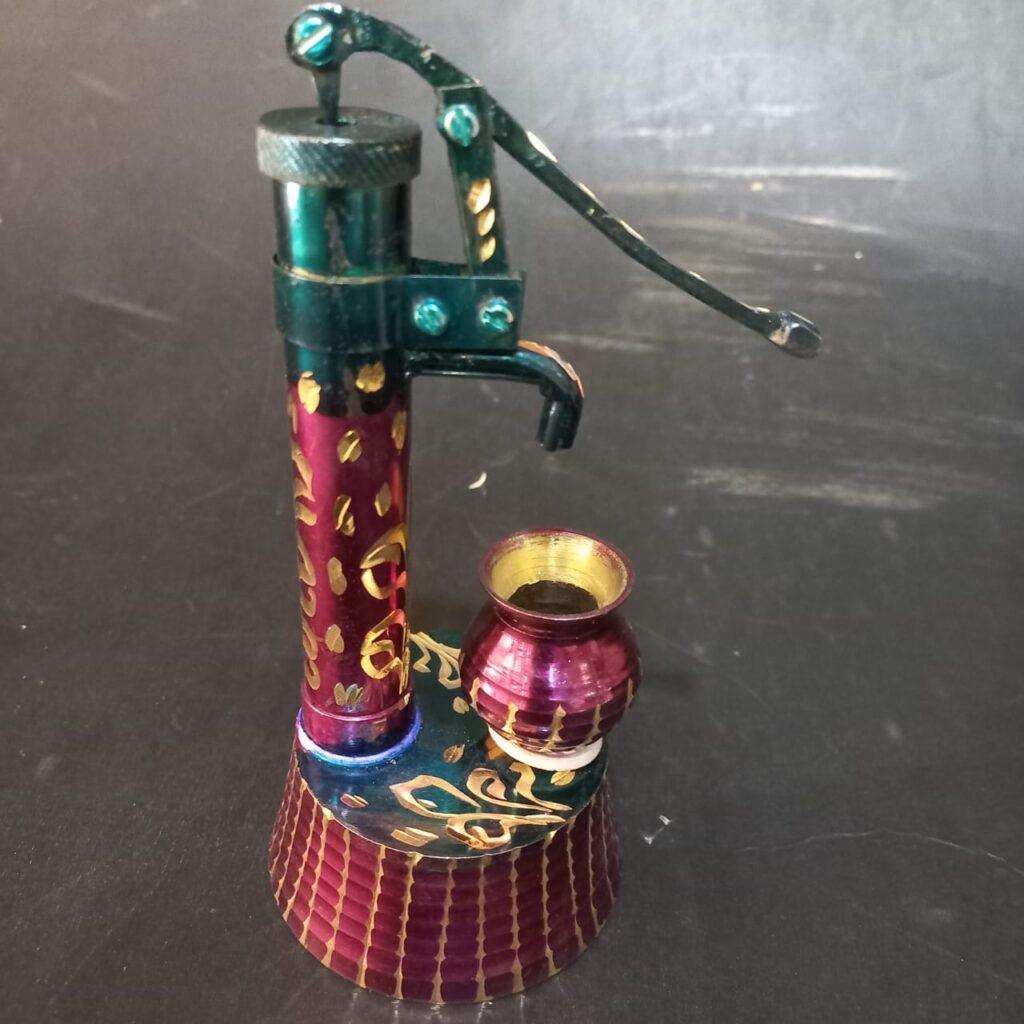 A brass model hand pump