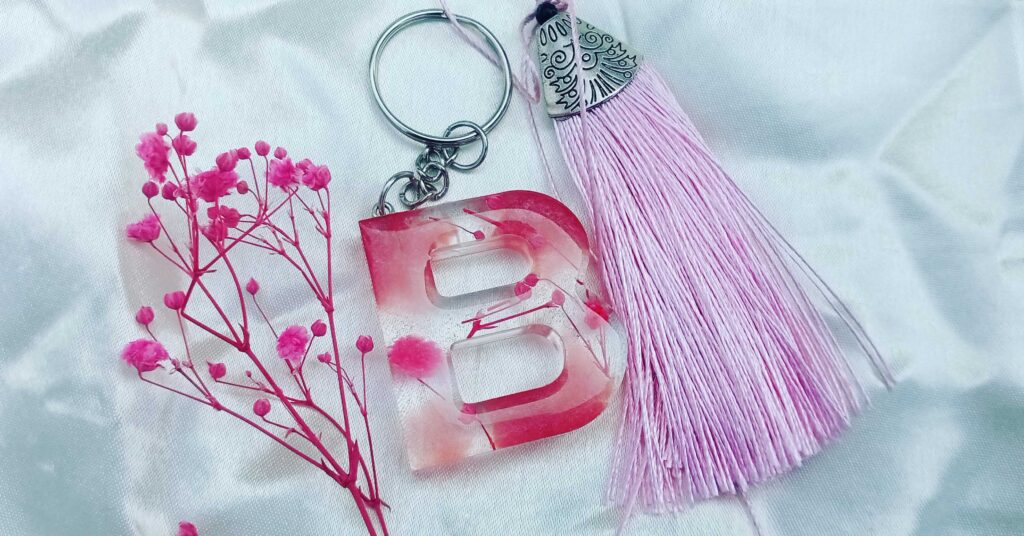 Resin Handmade Alphabets Keychains, Assorted designs & colours Available A to Z Letters, preserved with dry flowers & gold foils.